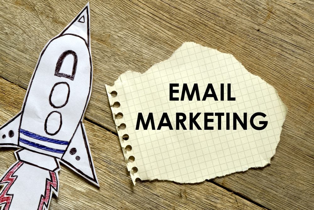 Paper rocket with paper written EMAIL MARKETING